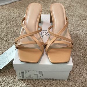Brand new! Squared open toe and squared heal sandal. Never worn.